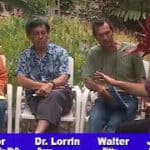 A group of people sitting on chairs in front of each other.