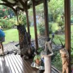 A person standing on the porch of a house.