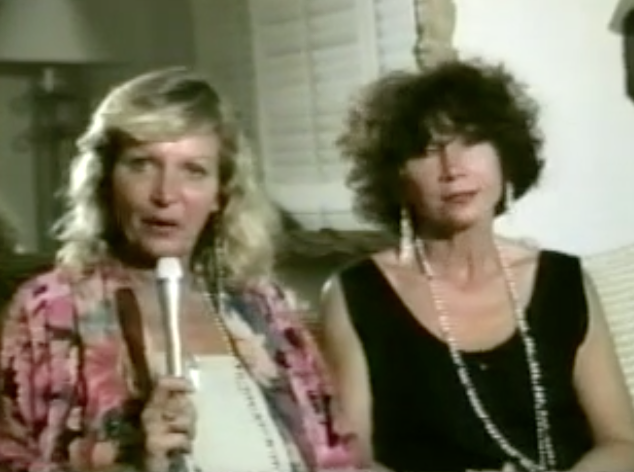 Two women are standing next to each other.