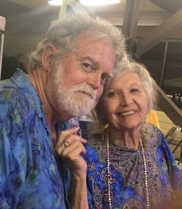 A man and woman pose for the camera.